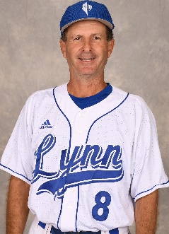 A baseball player wearing a black shirt Description automatically generated